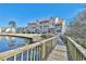Scenic view of condos by a pond, accessible by a charming wooden bridge enhancing the community's appeal at 510 Fairwood Lakes Dr. # 18N, Myrtle Beach, SC 29577