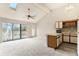 Inviting living space with vaulted ceilings, skylights, and sliding glass doors to the outdoor deck and a nearby kitchen at 510 Fairwood Lakes Dr. # 18N, Myrtle Beach, SC 29577