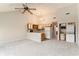 Open floor plan with vaulted ceilings leading to a kitchen and a laundry area with stackable appliances at 510 Fairwood Lakes Dr. # 18N, Myrtle Beach, SC 29577