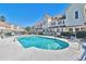 Community pool surrounded by condos provides a refreshing escape with lounge chairs for relaxation and enjoyment at 510 Fairwood Lakes Dr. # 18N, Myrtle Beach, SC 29577