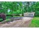 Large backyard with garage, lawn, and treed perimeter offers privacy at 5113 Pee Dee Ln., Murrells Inlet, SC 29576
