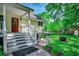 Backyard with patio area, fire pit, grill, and landscaping at 5113 Pee Dee Ln., Murrells Inlet, SC 29576