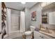 Clean bathroom with a shower-tub combo, neutral wall color, and a light-colored vanity at 5113 Pee Dee Ln., Murrells Inlet, SC 29576