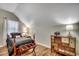 Bedroom featuring hardwood floors, black bed linens, and a painted wooden dresser at 5113 Pee Dee Ln., Murrells Inlet, SC 29576