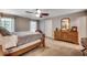 Comfortable bedroom featuring a bed, windows providing natural light, and a dresser at 5113 Pee Dee Ln., Murrells Inlet, SC 29576
