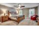 Relaxing bedroom showcasing a bed, windows for natural light, and a ceiling fan at 5113 Pee Dee Ln., Murrells Inlet, SC 29576