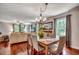 Open-concept dining area with hardwood floors and a seamless flow into the adjacent living room at 5113 Pee Dee Ln., Murrells Inlet, SC 29576