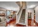 Beautiful home entryway featuring hardwood floors, stairway, and dining room with a table set for six at 5113 Pee Dee Ln., Murrells Inlet, SC 29576