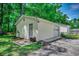 A large detached garage with landscaping along the perimeter at 5113 Pee Dee Ln., Murrells Inlet, SC 29576