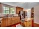 Spacious kitchen featuring wood cabinets, a stainless steel refrigerator, and a center island for food preparation at 5113 Pee Dee Ln., Murrells Inlet, SC 29576