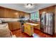 Stylish kitchen featuring stainless steel appliances, hardwood floors, a center island and bright lighting at 5113 Pee Dee Ln., Murrells Inlet, SC 29576