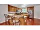 Well-appointed kitchen featuring stainless steel appliances, ample cabinetry, and bar seating area at 5113 Pee Dee Ln., Murrells Inlet, SC 29576
