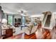 Spacious living room featuring gleaming hardwood floors, comfortable seating, and abundant natural light at 5113 Pee Dee Ln., Murrells Inlet, SC 29576