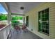 Covered porch with comfortable seating - ideal for outdoor relaxation at 5113 Pee Dee Ln., Murrells Inlet, SC 29576