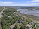 Picturesque coastal community with marsh views showcasing beautiful homes nestled among lush trees at 5460 Huntington Marsh Rd., Murrells Inlet, SC 29576