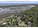 Picturesque coastal community with marsh views showcasing beautiful homes nestled among lush trees at 5460 Huntington Marsh Rd., Murrells Inlet, SC 29576