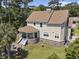 Home features a rounded porch, an outdoor seating area, and a brick-paved patio with a fountain at 5460 Huntington Marsh Rd., Murrells Inlet, SC 29576