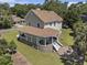 Charming home featuring a rounded porch, an outdoor seating area, and a brick-paved patio with a fountain at 5460 Huntington Marsh Rd., Murrells Inlet, SC 29576