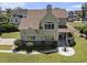 Lovely home with a covered front porch, a well-kept lawn, and beautiful landscaping and mature trees at 5460 Huntington Marsh Rd., Murrells Inlet, SC 29576