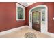 Beautiful foyer with a decorative mosaic tile floor and wood door at 5460 Huntington Marsh Rd., Murrells Inlet, SC 29576