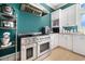 Gourmet kitchen with stainless steel appliances, gas range, and custom shelving at 5460 Huntington Marsh Rd., Murrells Inlet, SC 29576