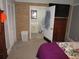 Comfortable bedroom featuring a brick wall, ensuite half bathroom, and TV on the dresser at 5578 Dongola Hwy., Conway, SC 29527