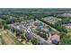 Aerial view of a residential complex with ample parking and surrounding trees at 5852 Longwood Dr. # 302, Murrells Inlet, SC 29576