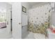 Bathroom with a decorative shower curtain, white door, and linen closet at 5852 Longwood Dr. # 302, Murrells Inlet, SC 29576