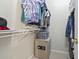 Organized walk-in closet with ample shelving and storage space, offering convenient and practical clothing solutions at 5852 Longwood Dr. # 302, Murrells Inlet, SC 29576