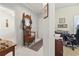 Bright hallway showcasing an antique mirror, storage bench, and entrances to other rooms at 5852 Longwood Dr. # 302, Murrells Inlet, SC 29576