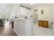 Open kitchen with marble countertops, white cabinets, and stainless steel appliances offering a spacious and bright cooking area at 5852 Longwood Dr. # 302, Murrells Inlet, SC 29576