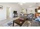 Comfortable living room featuring neutral tones, plush seating, and a ceiling fan, creating a relaxing atmosphere at 5852 Longwood Dr. # 302, Murrells Inlet, SC 29576