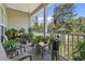 Covered porch filled with potted plants offering serene outdoor space at 5852 Longwood Dr. # 302, Murrells Inlet, SC 29576