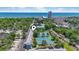 Aerial shot of the property including tennis courts and community pool with ocean view in the distance at 5905 South Kings Hwy. # 5202, Myrtle Beach, SC 29575