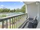 Balcony view overlooking tennis courts with table and chairs, great for outdoor relaxation at 5905 South Kings Hwy. # 5202, Myrtle Beach, SC 29575