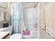 Compact bathroom featuring a shower/tub combo with white tile and a patterned blue shower curtain at 5905 South Kings Hwy. # 5202, Myrtle Beach, SC 29575