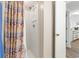 Bathroom shower, showing a white shower stall and a beach-themed shower curtain at 5905 South Kings Hwy. # 5202, Myrtle Beach, SC 29575