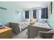 Cozy bedroom featuring twin beds, soft lighting, and a peaceful retreat at 5905 South Kings Hwy. # 5202, Myrtle Beach, SC 29575