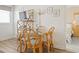 Casual dining area with glass table and four wicker chairs, with view into the bedroom at 5905 South Kings Hwy. # 5202, Myrtle Beach, SC 29575