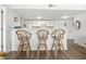 Kitchen counter with stylish rattan barstools, white cabinets and plenty of natural light at 5905 South Kings Hwy. # 5202, Myrtle Beach, SC 29575