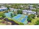 Aerial view of well-maintained tennis courts, landscaped ponds and surrounding residential buildings at 5905 South Kings Hwy. # 5202, Myrtle Beach, SC 29575