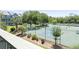 Scenic view from balcony overlooking well-maintained community tennis courts surrounded by lush landscaping at 5905 South Kings Hwy. # 5202, Myrtle Beach, SC 29575