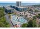 Aerial view of condo complex featuring lazy river, parking, and the ocean in the background at 5905 South Kings Hwy. # A518, Myrtle Beach, SC 29575