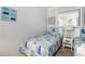 Inviting bedroom with a coastal theme, featuring twin beds, wicker nightstand, and serene decor for a relaxing stay at 5905 South Kings Hwy. # A518, Myrtle Beach, SC 29575