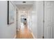 Hallway showcasing light walls, wood-look floors, and openings to the living room and bedrooms at 5905 South Kings Hwy. # A518, Myrtle Beach, SC 29575
