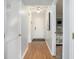 Bright hallway featuring wood floors, white walls, and views into the bedroom and entryway at 5905 South Kings Hwy. # A518, Myrtle Beach, SC 29575
