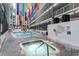 Stunning indoor pools surrounded by a multi-level atrium, colorful banners, and inviting lounge areas at 5905 South Kings Hwy. # A518, Myrtle Beach, SC 29575