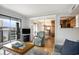 Comfortable living room open to the dining area with a balcony and neutral color scheme at 5905 South Kings Hwy. # A518, Myrtle Beach, SC 29575