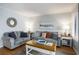 Inviting living room featuring plush seating, nautical-themed art, and ample natural light at 5905 South Kings Hwy. # A518, Myrtle Beach, SC 29575