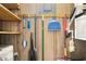 Well-organized utility room with shelving and cleaning supplies neatly arranged on the wall for convenience at 5905 South Kings Hwy. # A518, Myrtle Beach, SC 29575